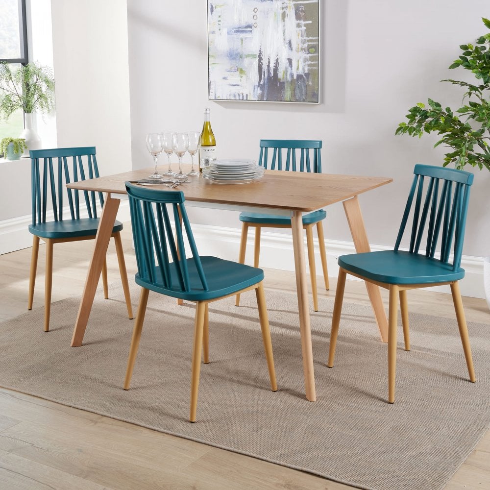 Wooden dining table with wooden chairs in teal