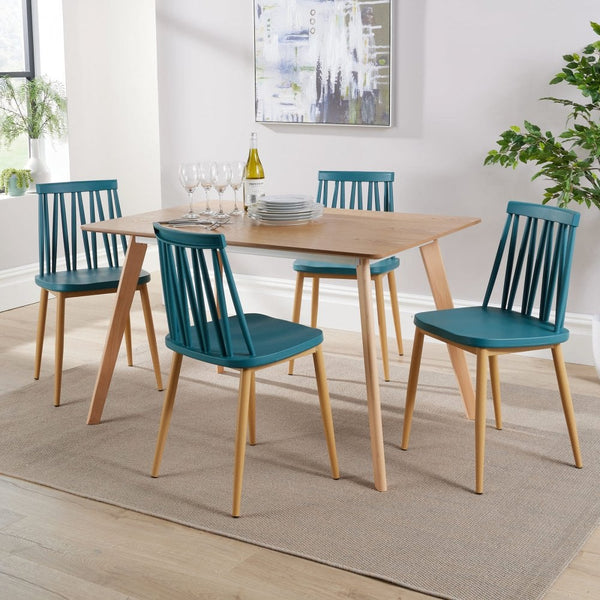 Wooden dining table with wooden chairs in teal